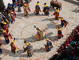 Mustang Lo Manthang Tiji Festival Day 1 04-4 Dorje Jono And Monks Dance I climbed the stairs of the King�s Palace to the roof for an overhead view of the mandala supporting the first dance of the Tiji Festival in Lo Manthang.